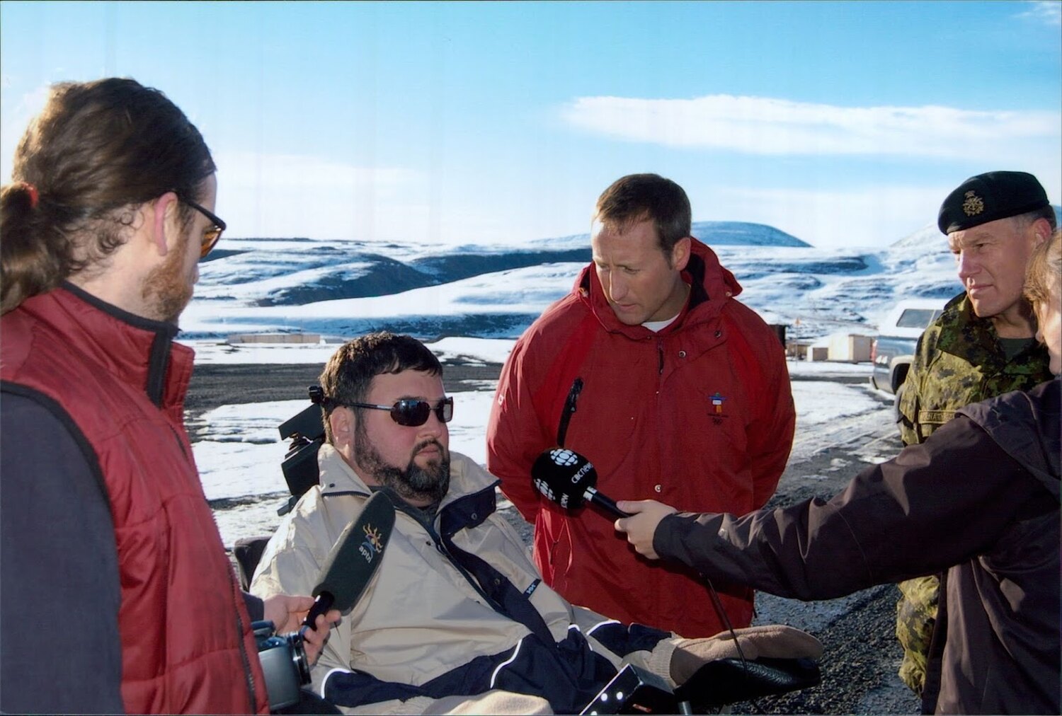 Steven Fletcher speaking with journalists during a northern visit