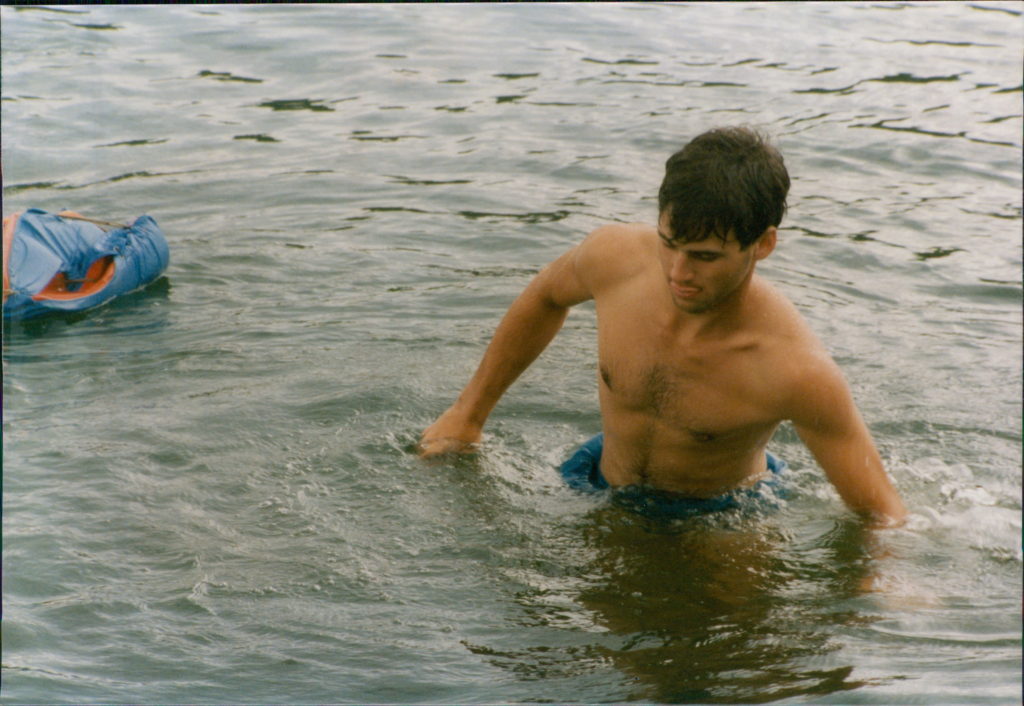 Strange picture of Steven sliding some slimy rock on a gorgeous Blue lake with rocky shores in the Canadian Shield.
